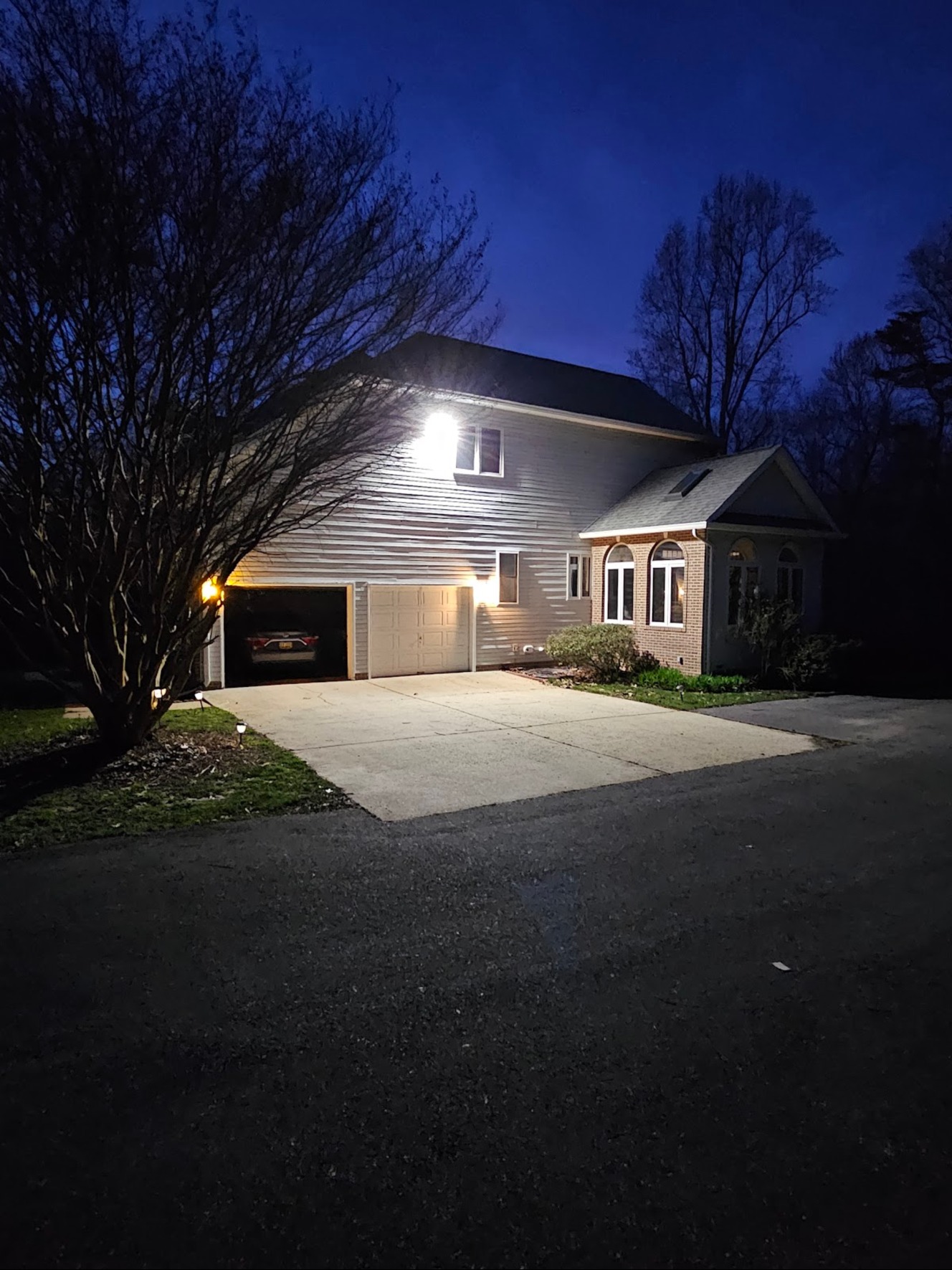Residential exterior and driveway lighting at night in Washington, DC — Schmidt's Electrical