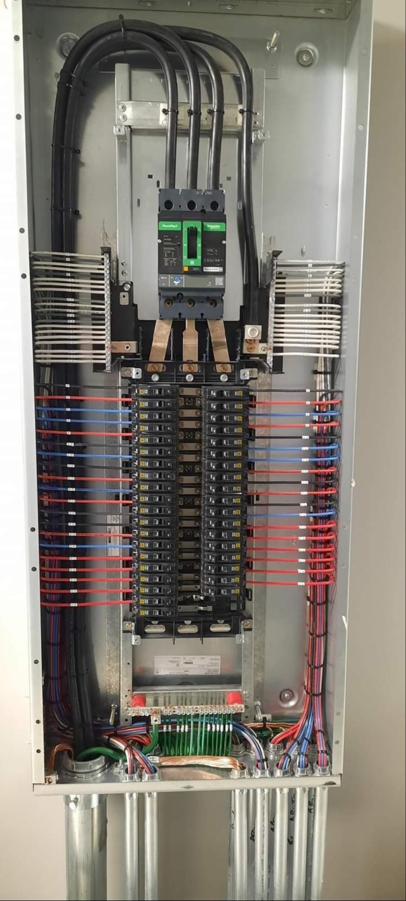 Electrical panel with circuit breakers and conduit in Washington, DC — Schmidt's Electrical