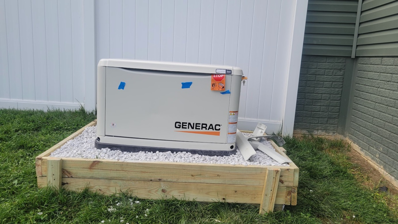 Standby generator installed on a gravel pad in Washington, DC — Schmidt's Electrical