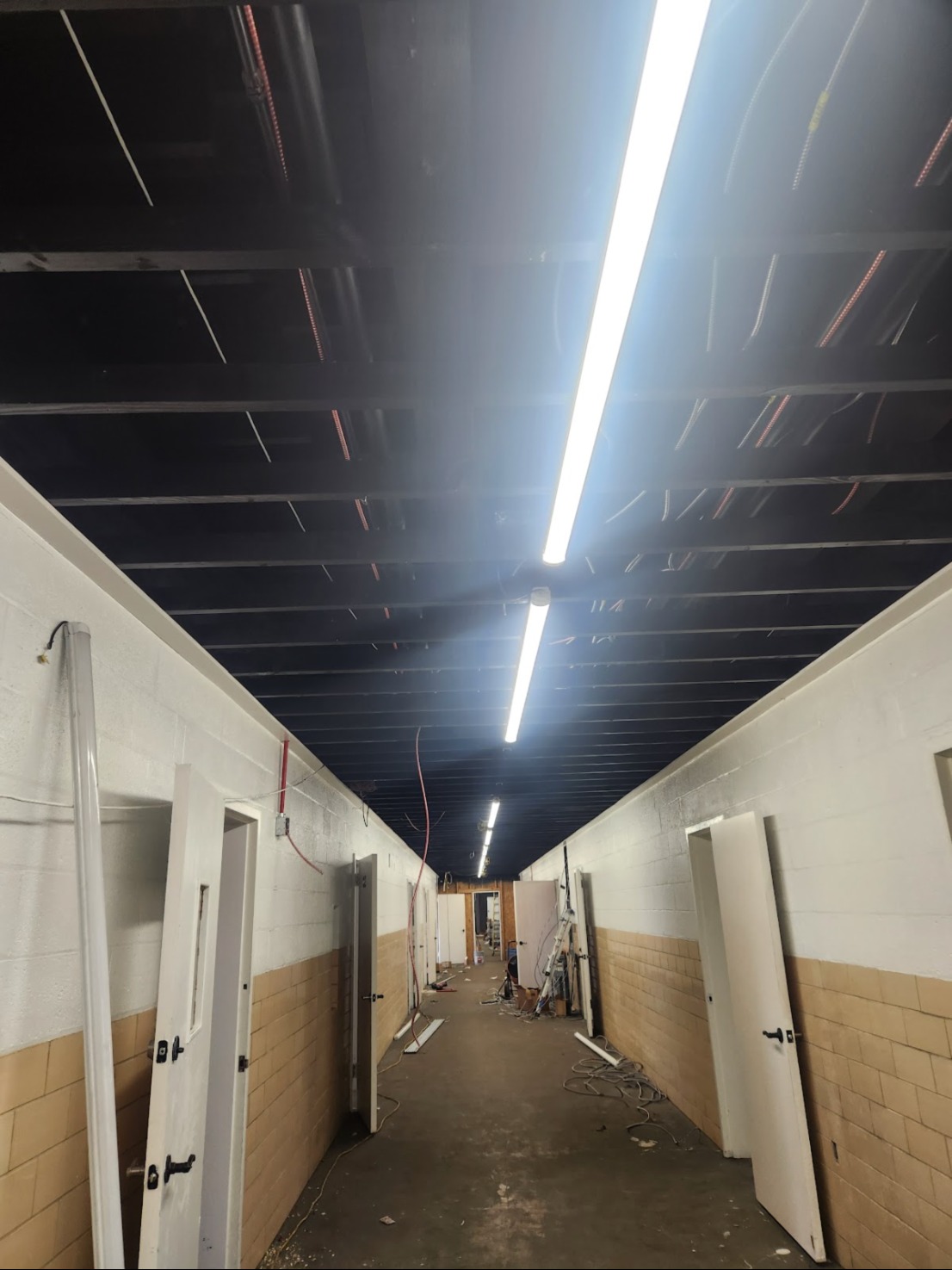 Commercial build-out hallway with linear LED lighting in Washington, DC — Schmidt's Electrical